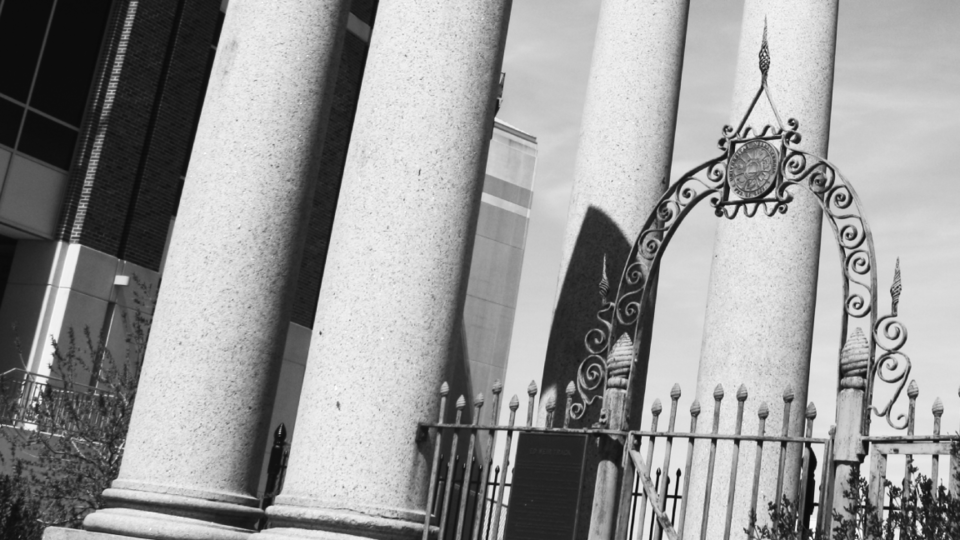 Black and white photo of a gate on the University of Nebraska-Lincoln Campus