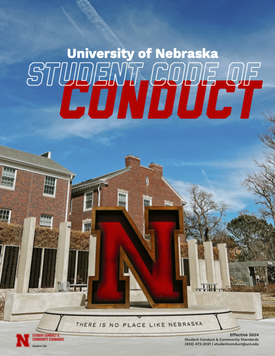 University of Nebraska campus with large red "N" sculpture and brick building in the background.